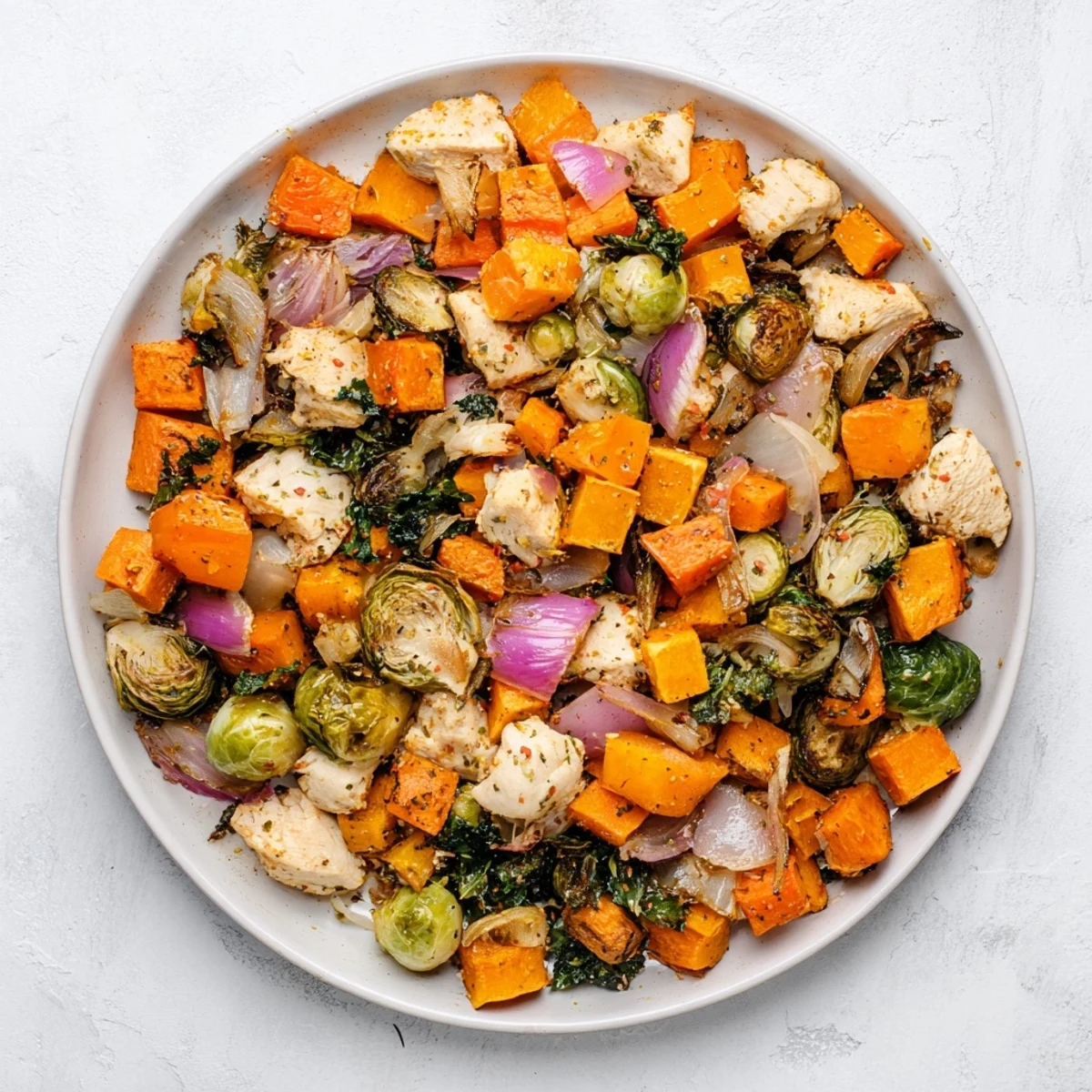 Steaming-hot Winter Garden Paleo Bake, showcasing colorful veggies and optional chicken for dinner.