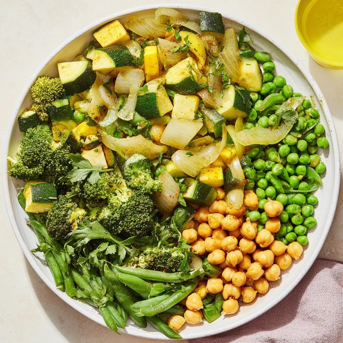 Steaming Evergreen Vegan Skillet, full of colorful veggies and chickpeas, a delicious one-pan meal!