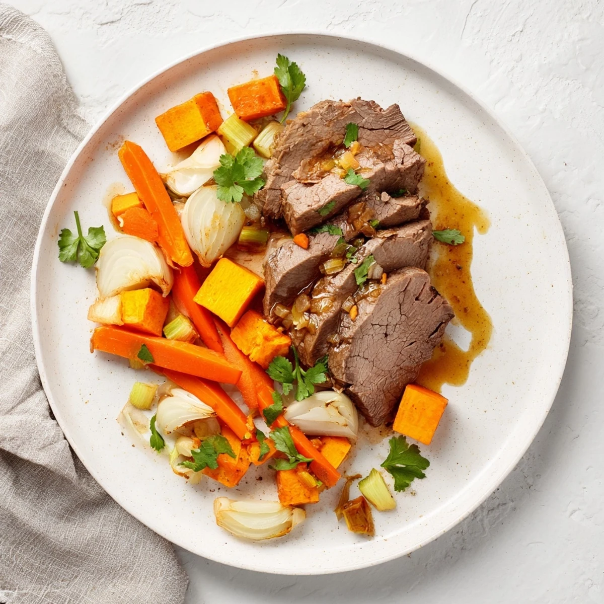Tender Winter Wellness Paleo Roast surrounded by caramelized carrots, parsnips, and sweet potatoes in a savory broth.