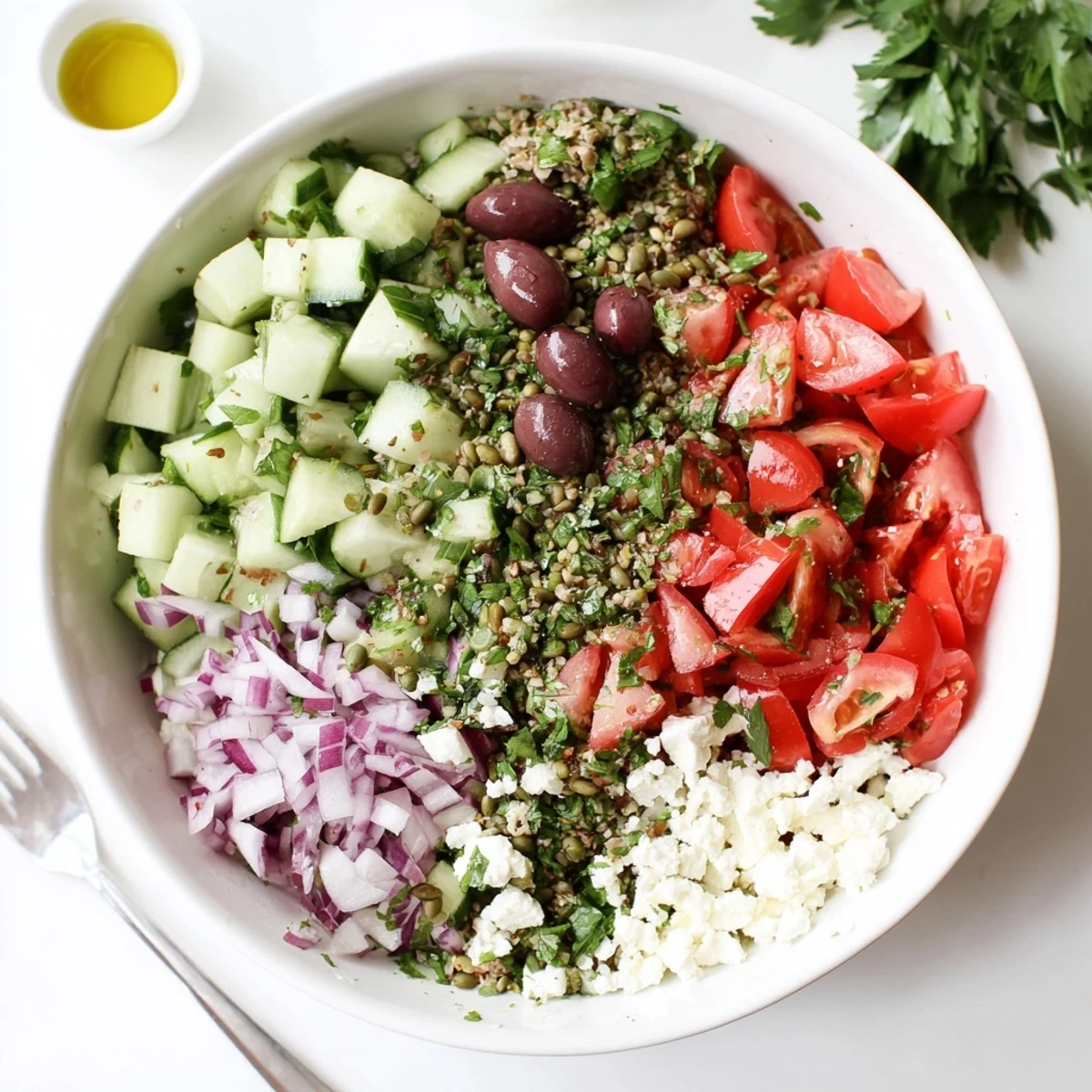 Bright, herbaceous Mediterranean Cucumber Tomato and Hemp Salad garnished with mint and optional olives on a rustic table.