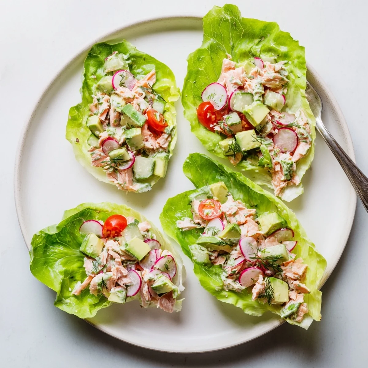 Golden roasted salmon salad nestled in crisp butter lettuce cups with creamy green goddess dressing