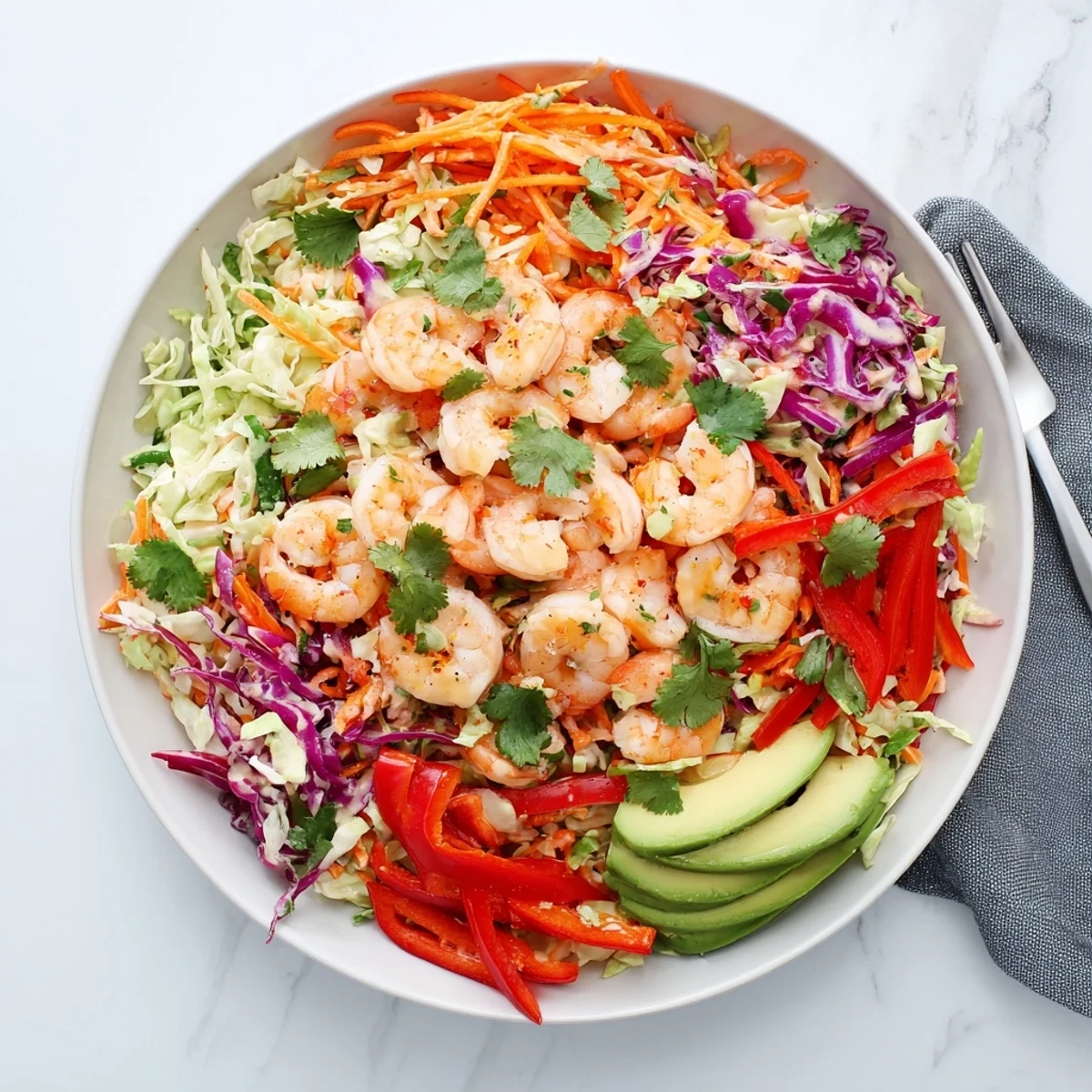 Fresh avocado lime shrimp and cabbage crunch salad featuring creamy avocado, crisp cabbage slaw, and zesty lime dressing