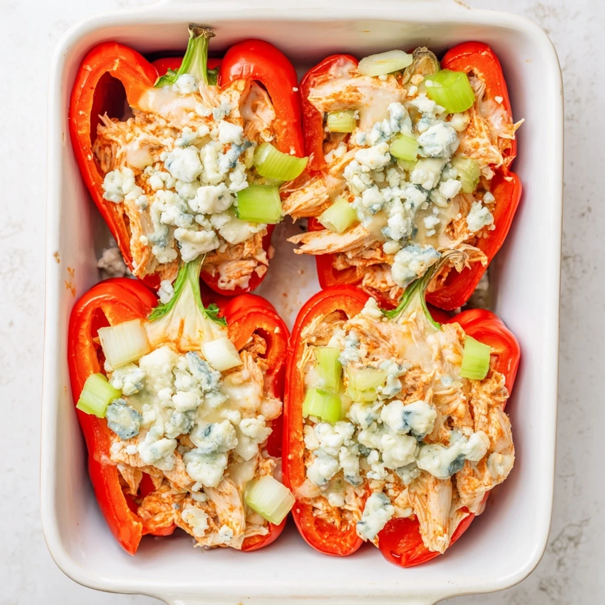 Protein-packed stuffed peppers filled with zesty chicken and cottage cheese blend