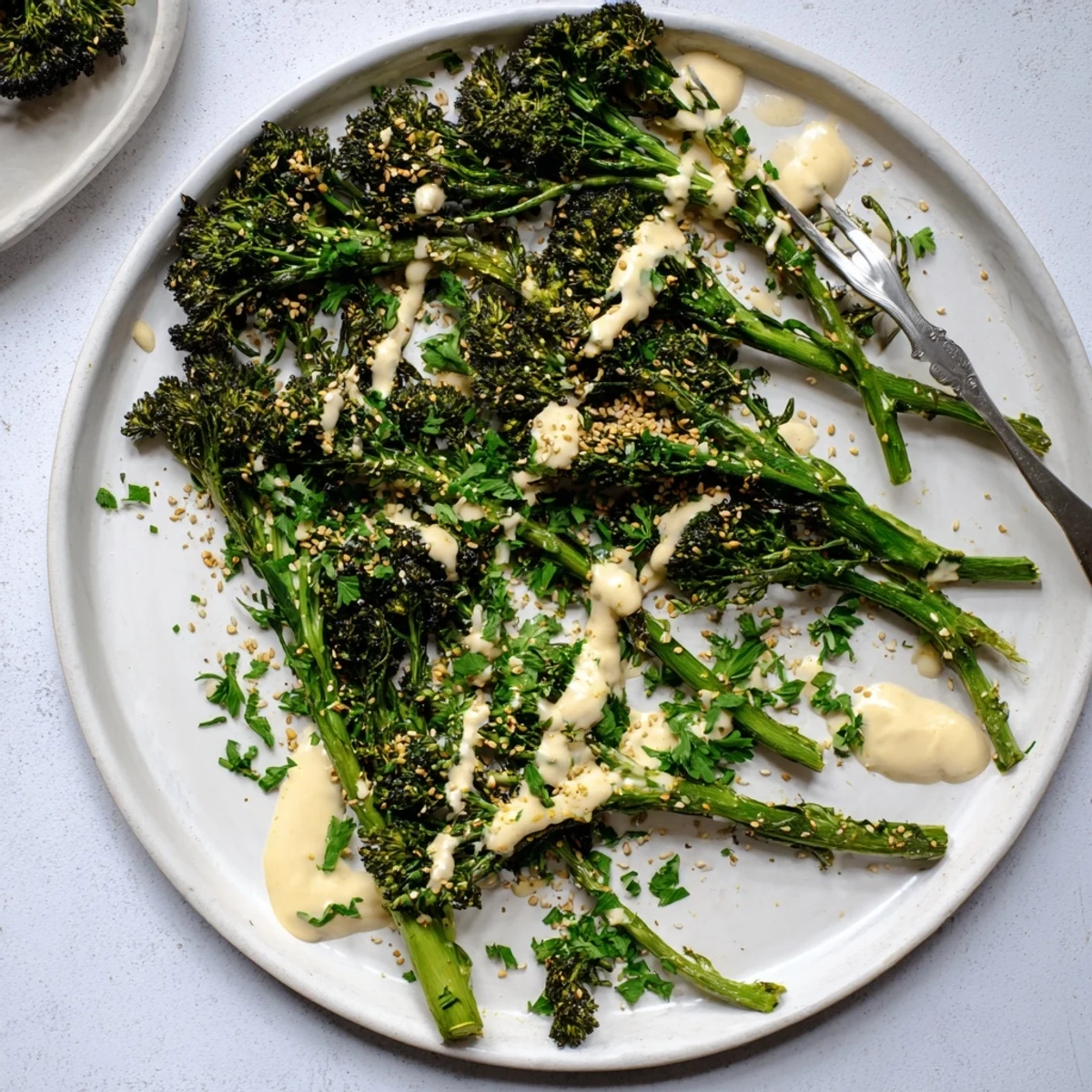 Vibrant broccolini roasted until crispy and topped with tangy sesame lemon dressing